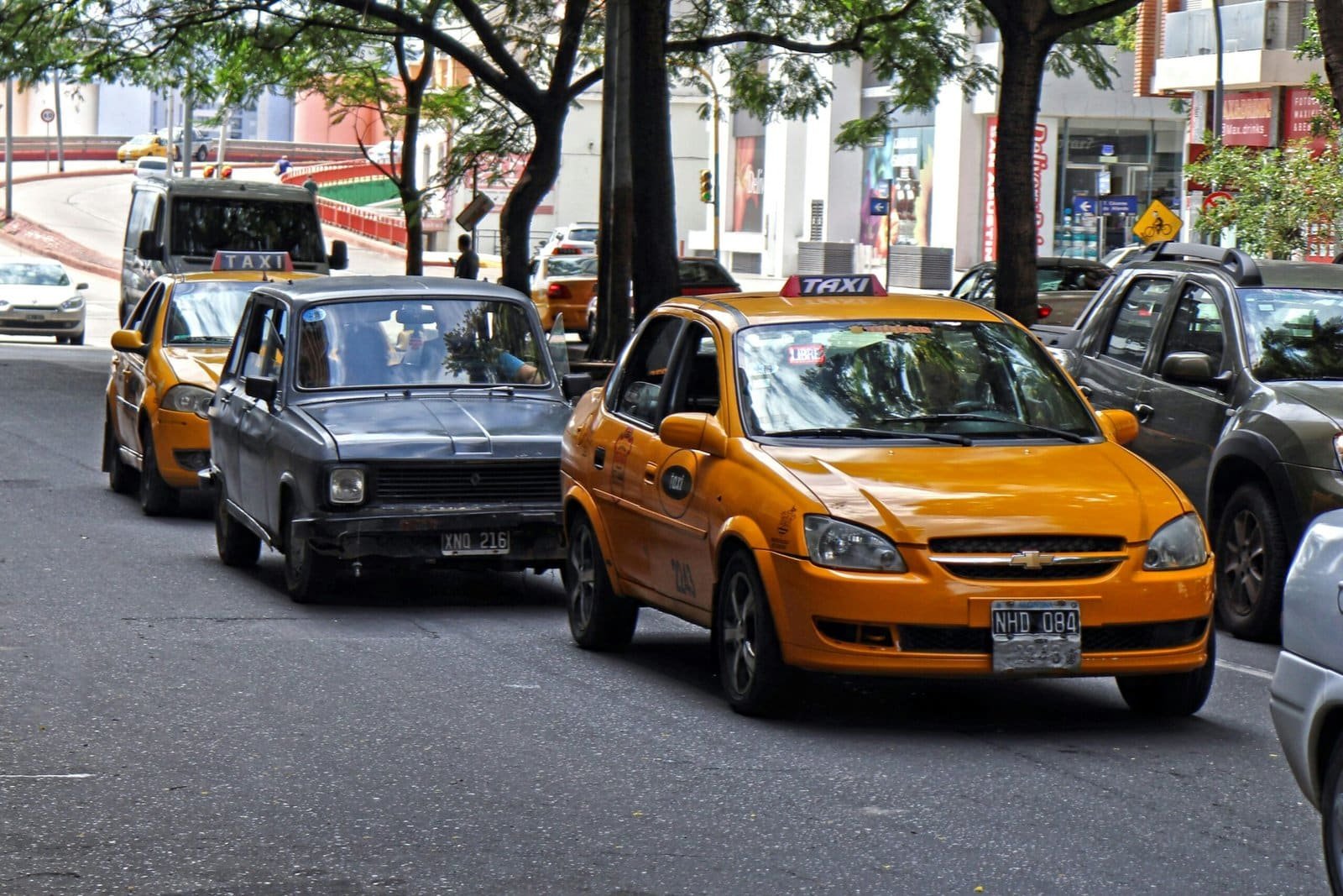 a couple of cars that are sitting in the street